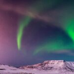 Auroras Boreales en las montañas de Islandia. Sin duda, uno de los lugares más increíbles para verlas. Foto por Mike Swigunski.