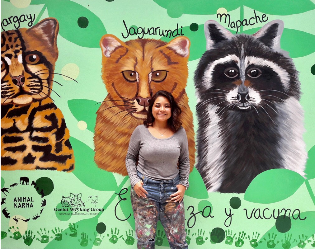 Un mural de la fauna local, incluido el yaguarundí, en una escuela primaria de Tepetzingo, en el estado de Morelos (México), pintado por la artista Montse Tello por encargo del Grupo de Trabajo sobre el Ocelote. Imagen cortesía de Montse Tello