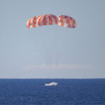 NASA’s Orion spacecraft with Artemis II crewmembers NASA astronauts Reid Wiseman, commander; Victor Glover, pilot; Christina Koch, mission specialist; and CSA (Canadian Space Agency) astronaut Jeremy Hansen, mission specialist aboard is seen as it lands in the Pacific Ocean off the coast of California, Friday, April 10, 2026. NASA’s Artemis II mission took Wiseman, Glover, Koch, and Hansen on a 10-day journey around the Moon and back to Earth. Following a splashdown at , NASA, U.S. Navy, and U.S. Air Force teams are working to bring the crewmembers and Orion spacecraft aboard USS John P. Murtha. Photo Credit: (NASA/Bill Ingalls)